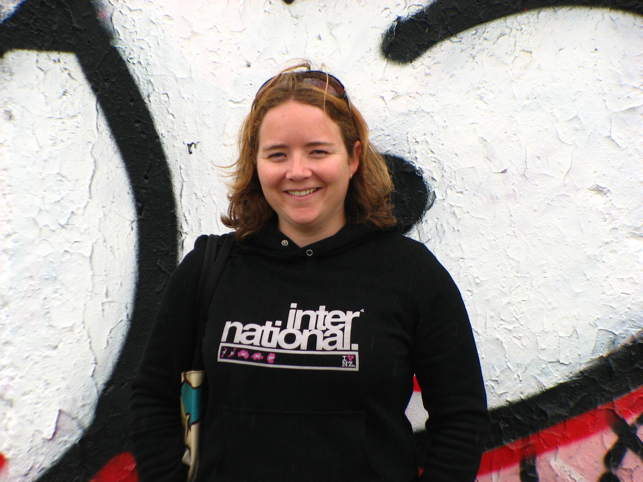 salena at berlin wall wearing huffer hoodie